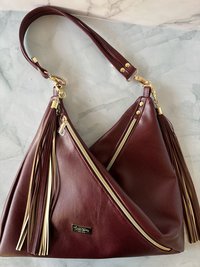 The Angler Slouchy Handbag - a rich, edgy, handbag with tassels + angled zipper giving it serious personality  - in a beautiful bordeaux faux leather