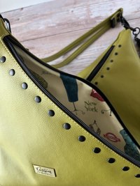 The Moss Renegade Handbag - Tassels, angles, rivets and a stunning colored synthetic leather