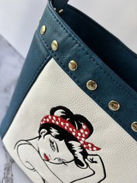 The Empowered Bucket Bag Set with Rosie vintage wartime icon inspired embroidery. Spacious, eye-catching, and designed for everyday style with attitude.