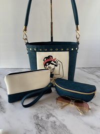 The Empowered Bucket Bag Set with Rosie vintage wartime icon inspired embroidery. Spacious, eye-catching, and designed for everyday style with attitude.