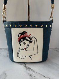 The Empowered Bucket Bag Set with Rosie vintage wartime icon inspired embroidery. Spacious, eye-catching, and designed for everyday style with attitude.