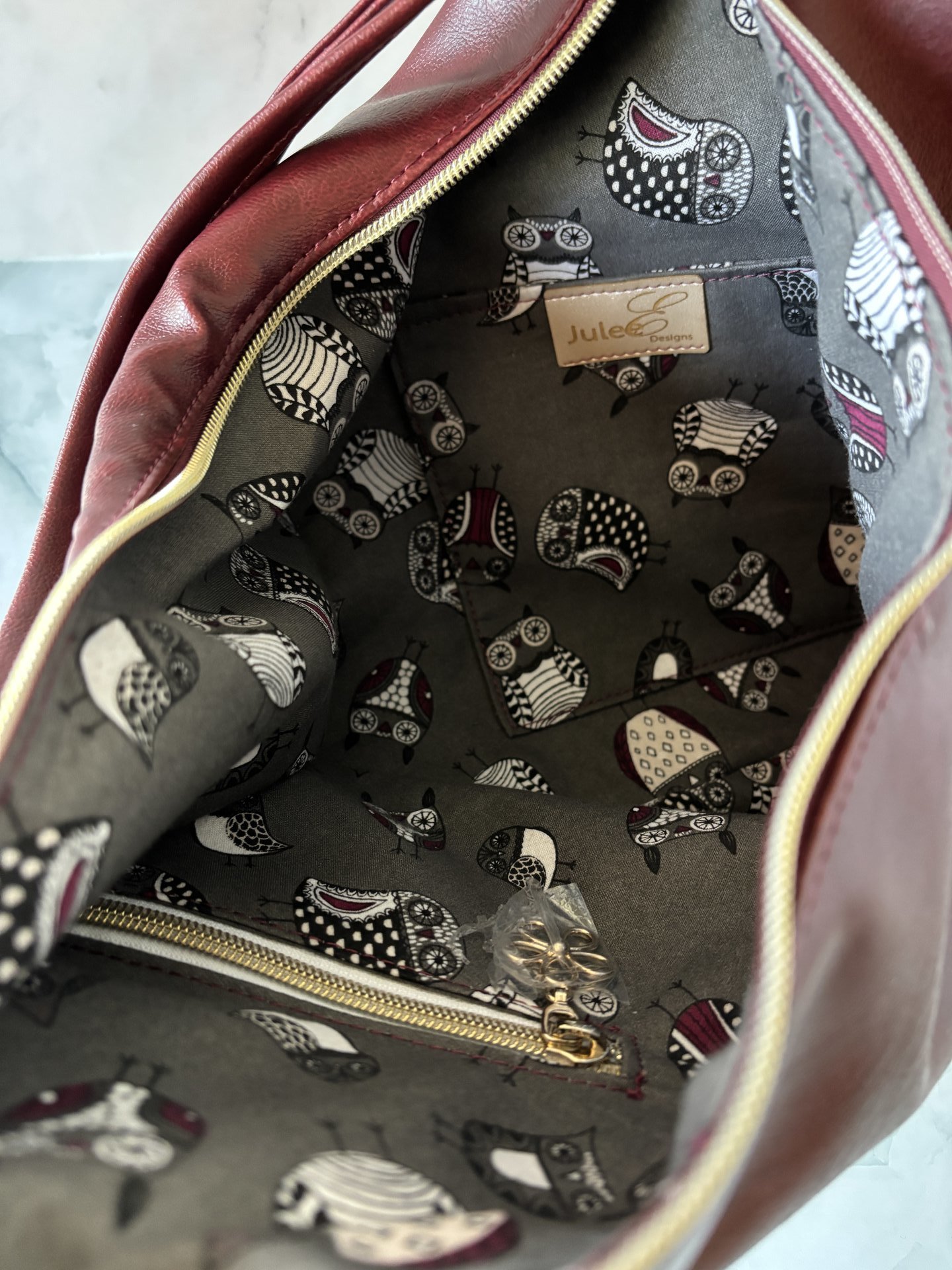 The Angler Slouchy Handbag - a rich, edgy, handbag with tassels + angled zipper giving it serious personality  - in a beautiful bordeaux faux leather