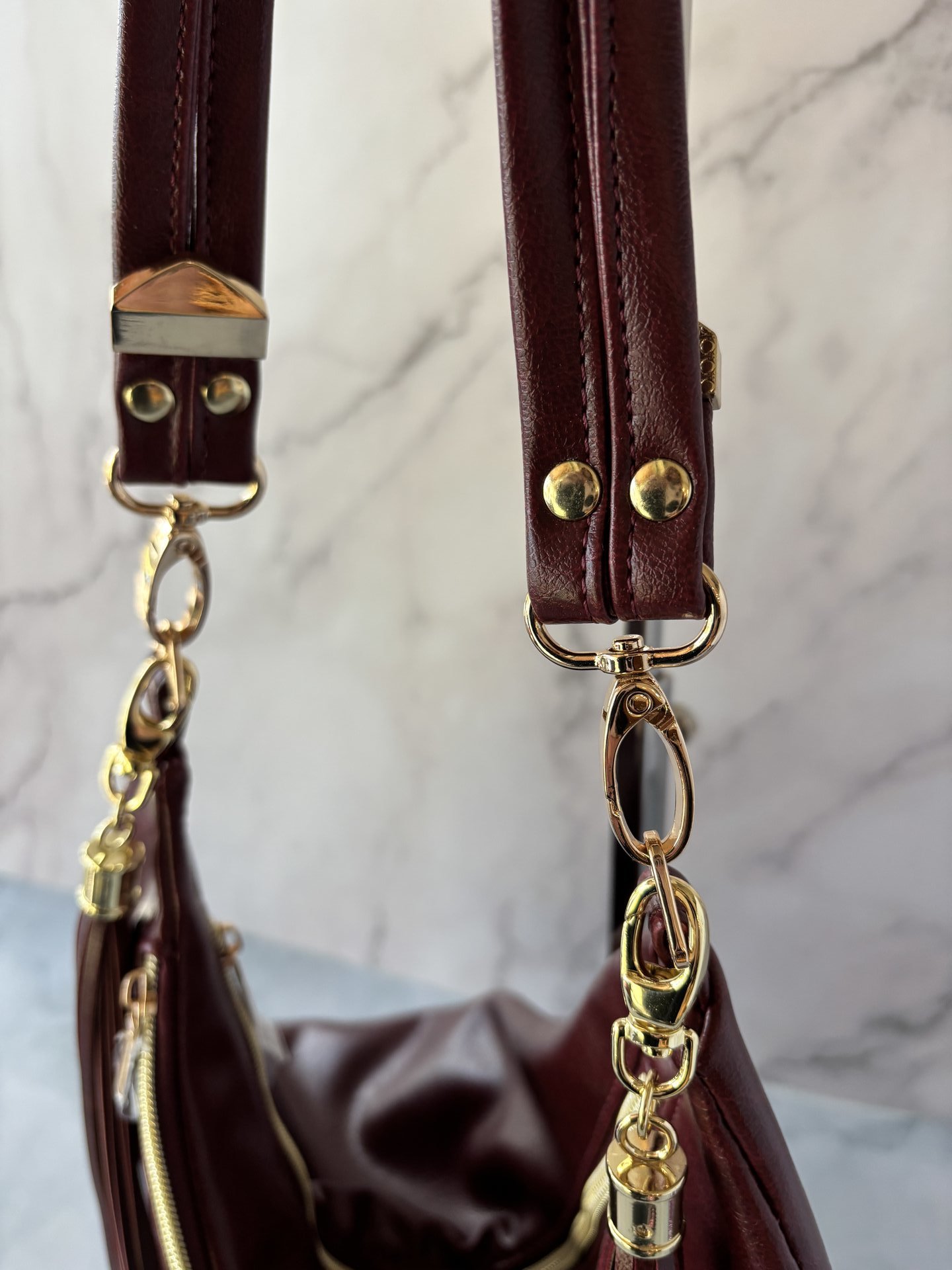 The Angler Slouchy Handbag - a rich, edgy, handbag with tassels + angled zipper giving it serious personality  - in a beautiful bordeaux faux leather