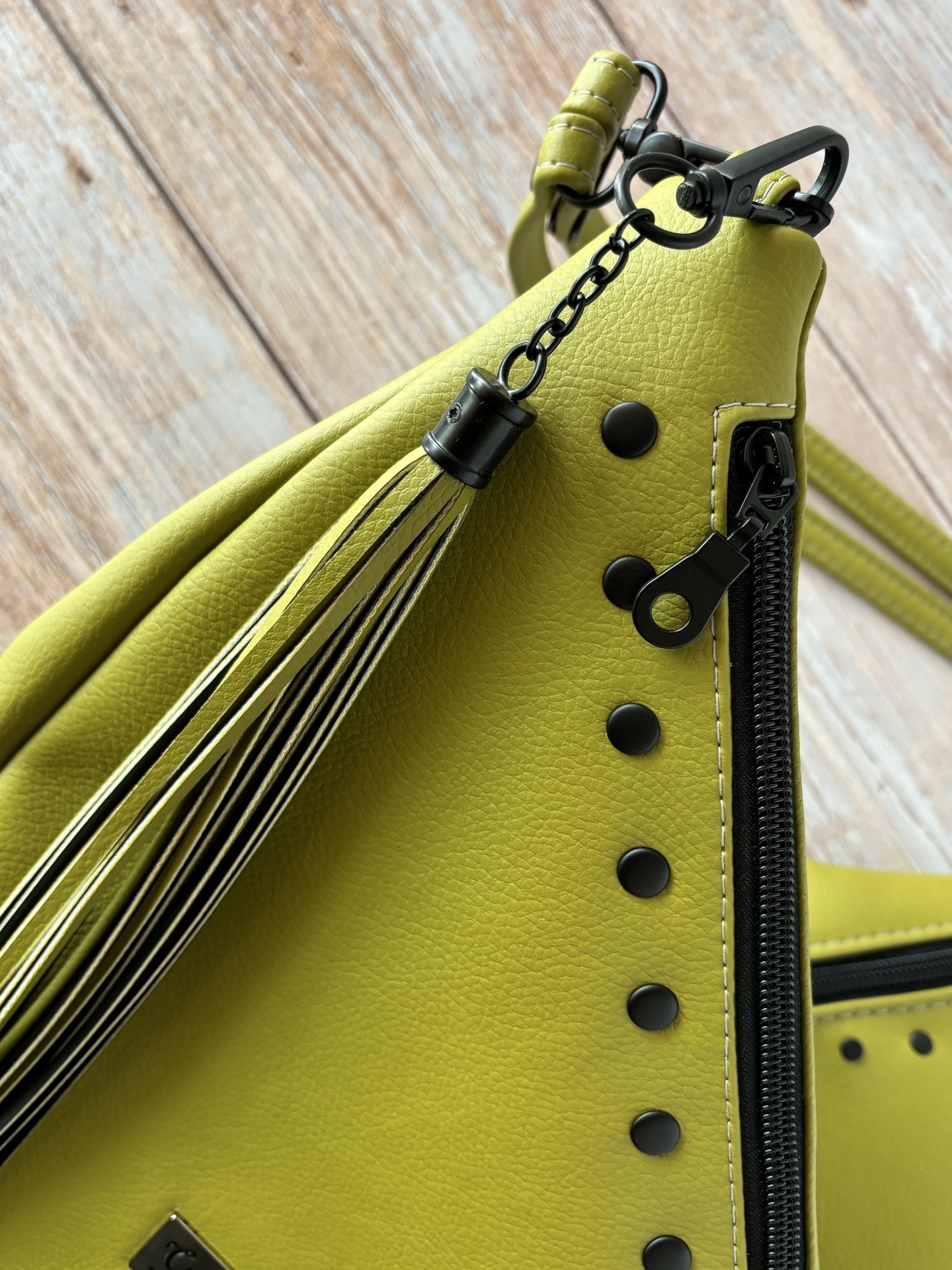 The Moss Renegade Handbag - Tassels, angles, rivets and a stunning colored synthetic leather