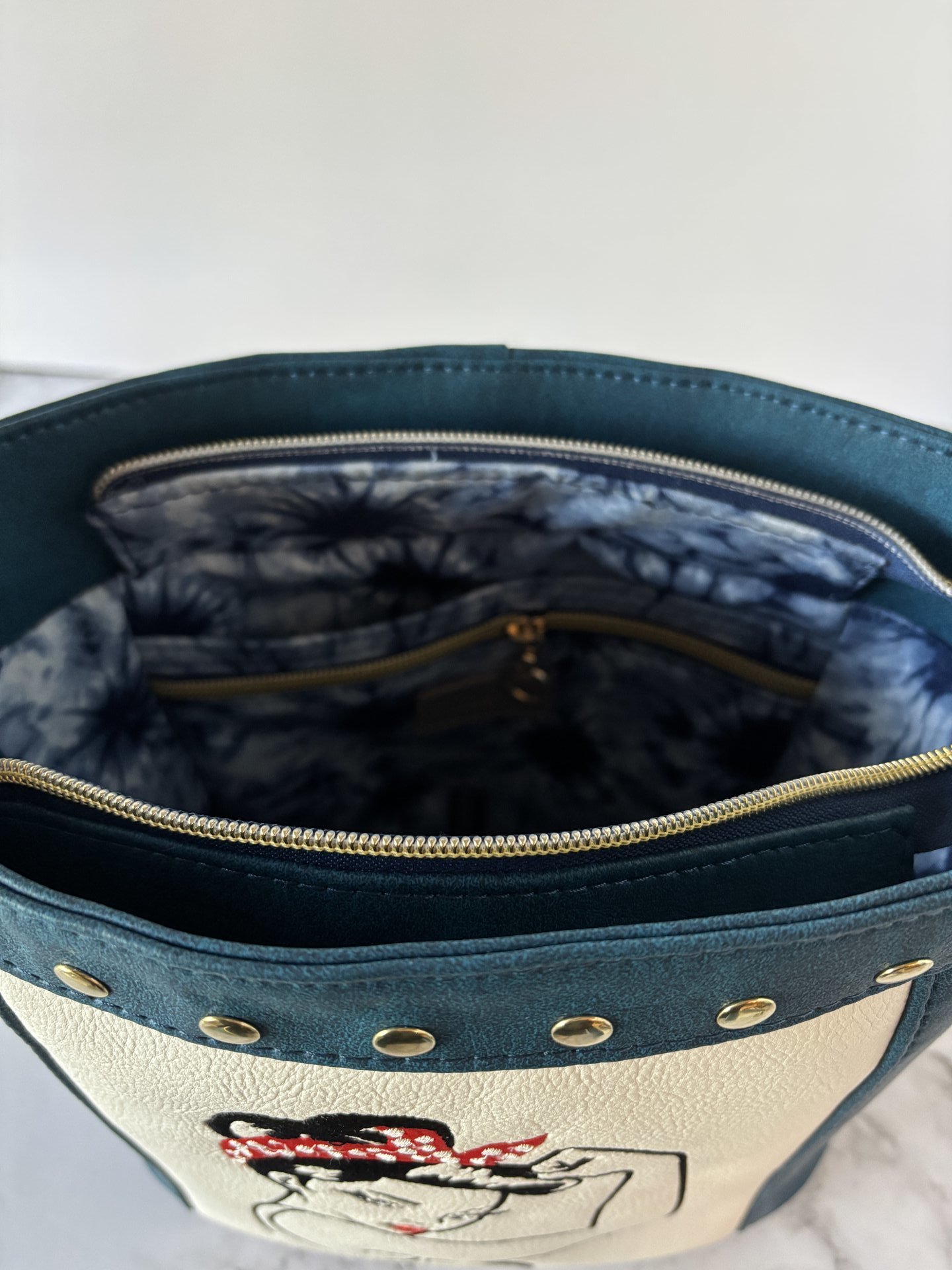 The Empowered Bucket Bag Set with Rosie vintage wartime icon inspired embroidery. Spacious, eye-catching, and designed for everyday style with attitude.